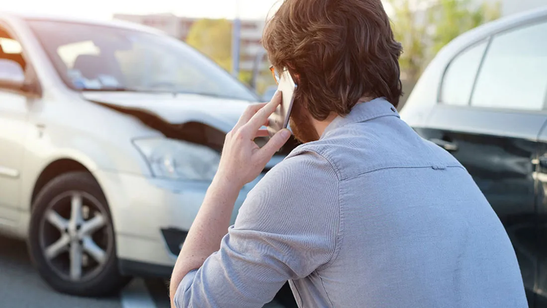 Family by car after accident